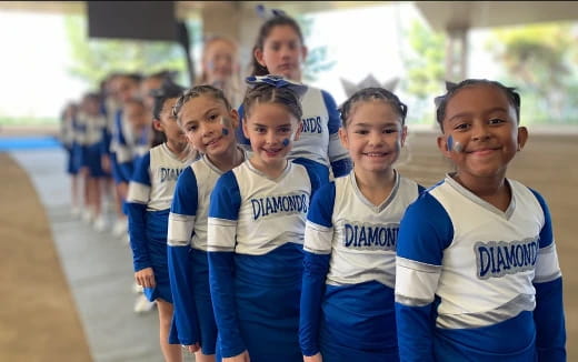 a group of girls in matching uniforms