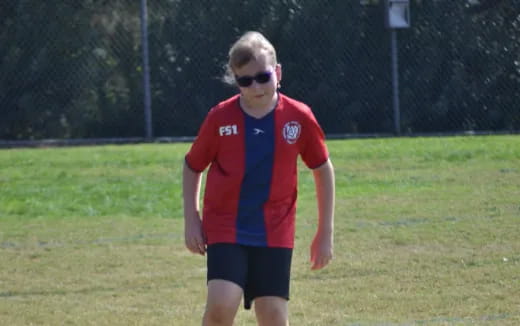 a boy in a red shirt