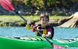 a boy in a kayak