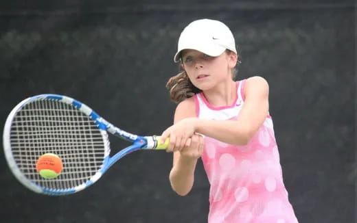 a girl playing tennis