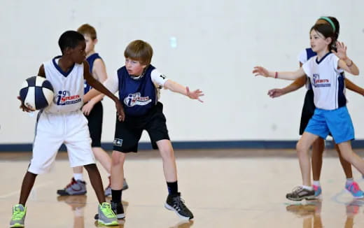 a group of kids playing football