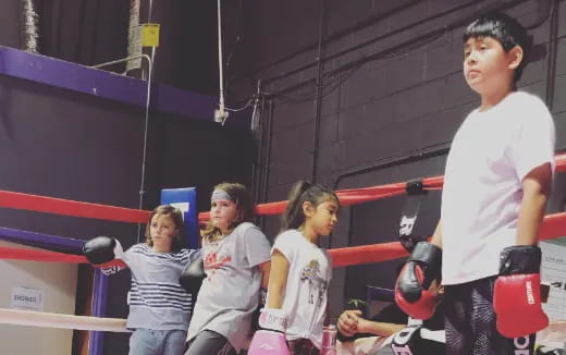 a group of people in a boxing ring