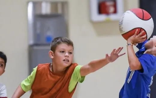 a boy holding a ball