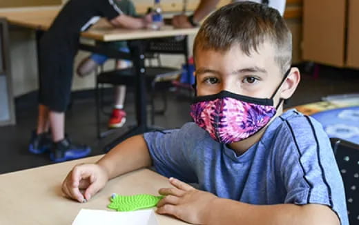 a boy sitting at a table