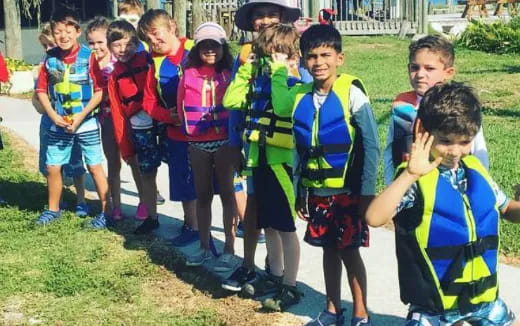 a group of children in school uniforms
