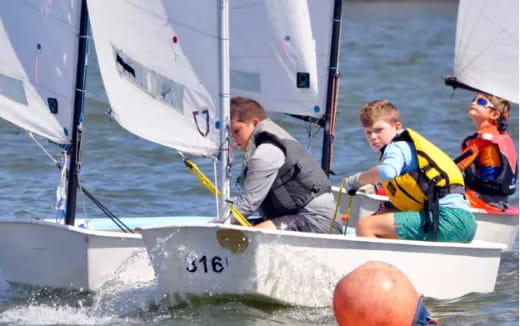 a group of people on a sailboat