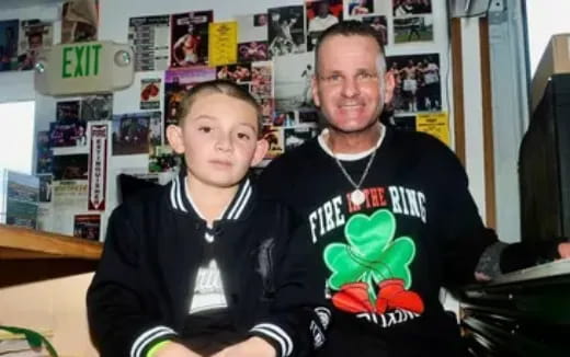 a person and a boy posing for a picture