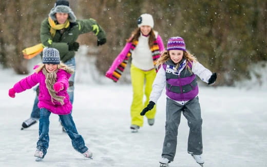 a group of people playing in the snow