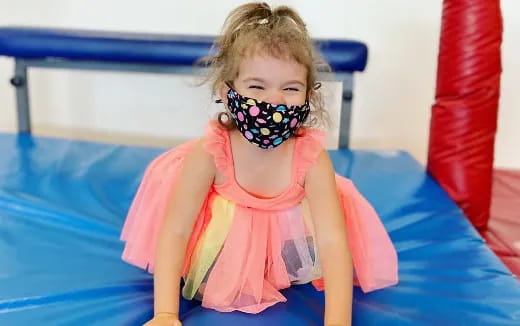 a girl wearing a mask