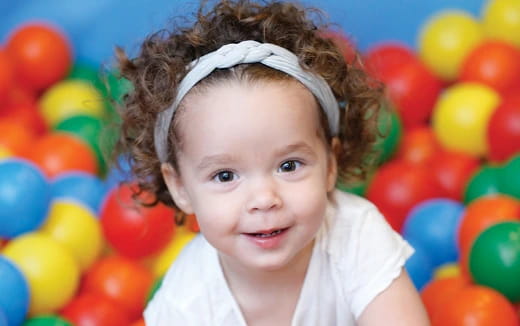 a child in a ball pit