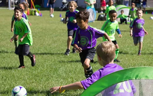 kids playing football on a field