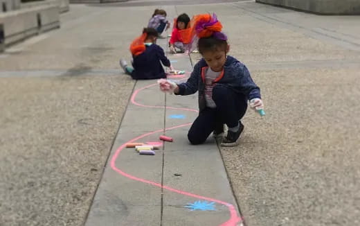 a group of children playing with a toy