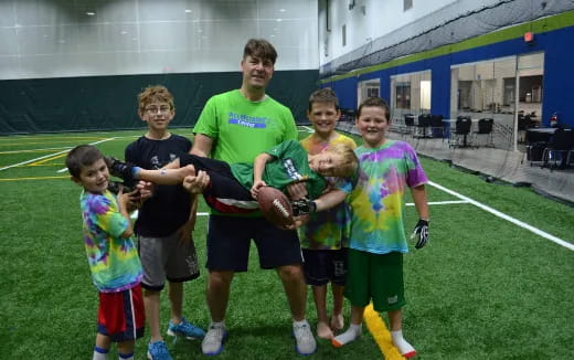 a group of people holding a trophy