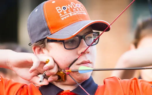 a person wearing a hat and glasses