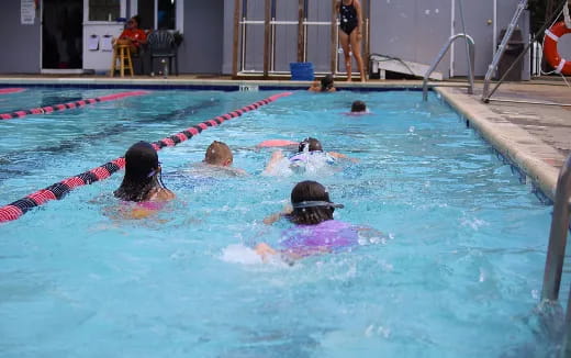 a group of people in a pool
