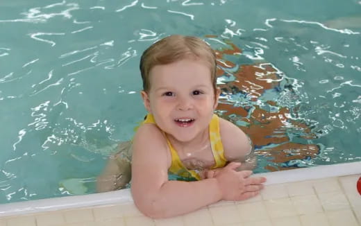 a baby in a pool