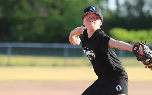 a boy throwing a baseball