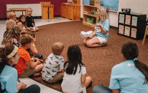 a group of children sitting in a circle