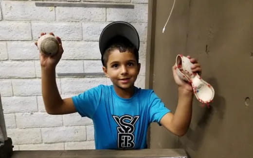 a boy holding a ball