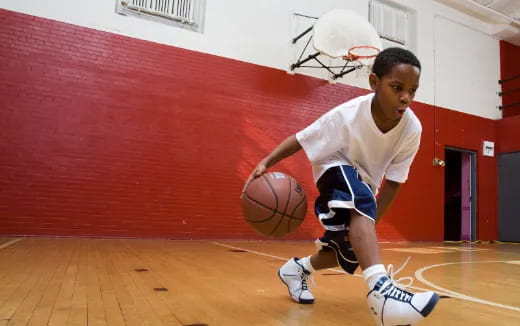 a boy playing basketball
