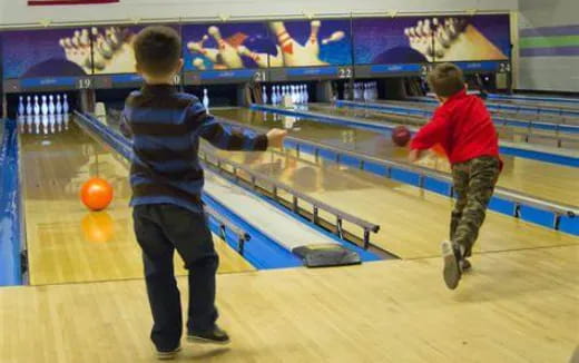 a couple of boys playing pool