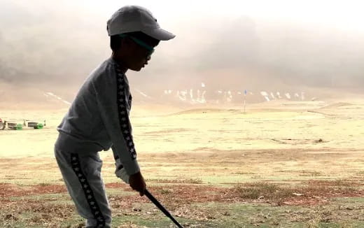 a man wearing a helmet and holding a gun