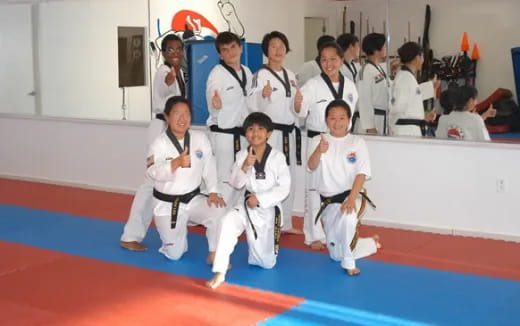 a group of people in karate uniforms