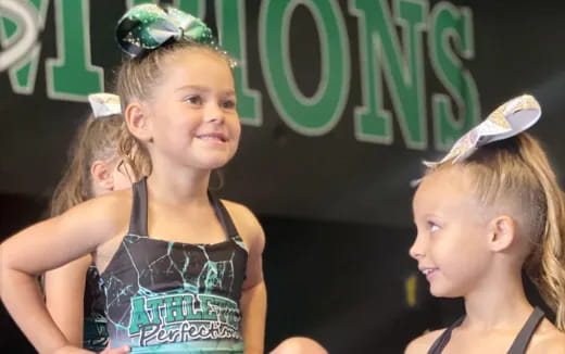 a woman with a ponytail and a girl with a ponytail