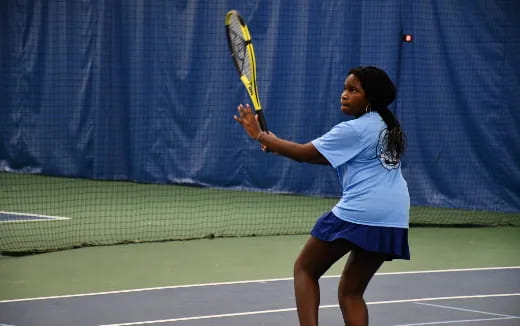 a woman playing tennis