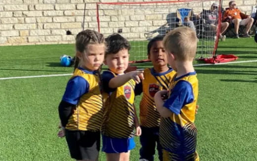 a group of boys playing football
