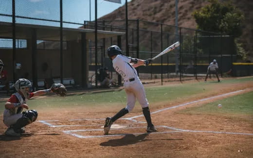 a baseball player swinging a bat