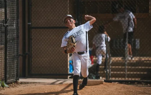 a baseball player throwing a ball