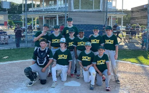 a group of baseball players posing for a photo