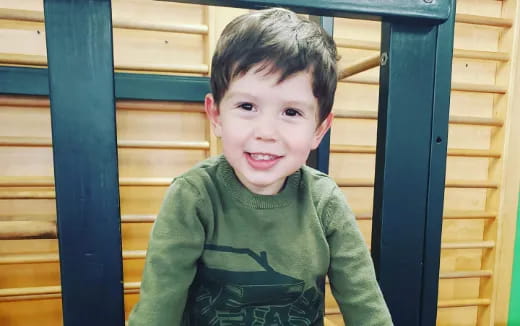 a boy smiling for the camera