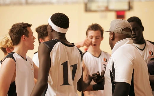 a group of men in white uniforms