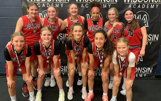 a group of people wearing sports uniforms