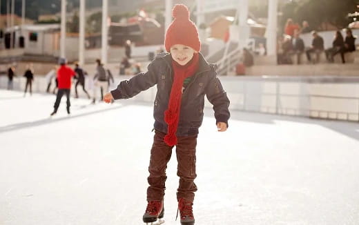 a person wearing a mask and standing in the snow