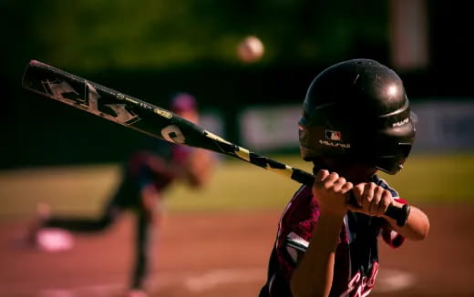 a baseball player swinging a bat