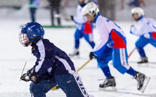 a group of people playing hockey