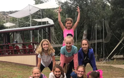 a group of children playing in a water park