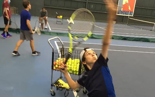 a person holding a tennis racket