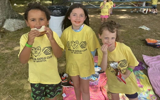 a group of children eating food