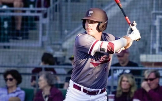 a baseball player swinging a bat