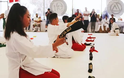 a man and woman in karate uniforms