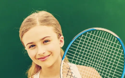 a woman holding a tennis racket