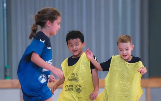 a group of kids in sports uniforms