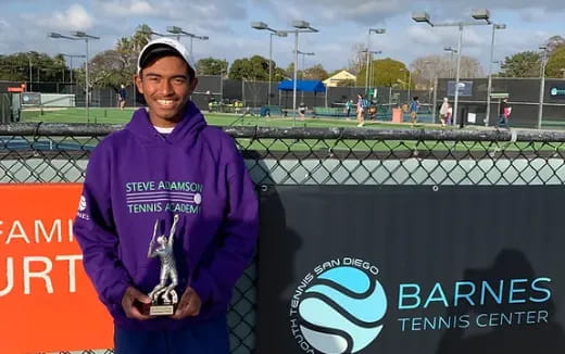 a man holding a trophy