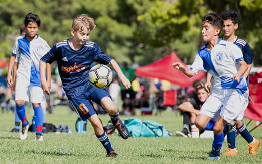 a group of boys playing football