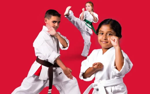 a group of people in karate uniforms