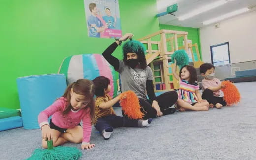 a group of children sitting on the floor